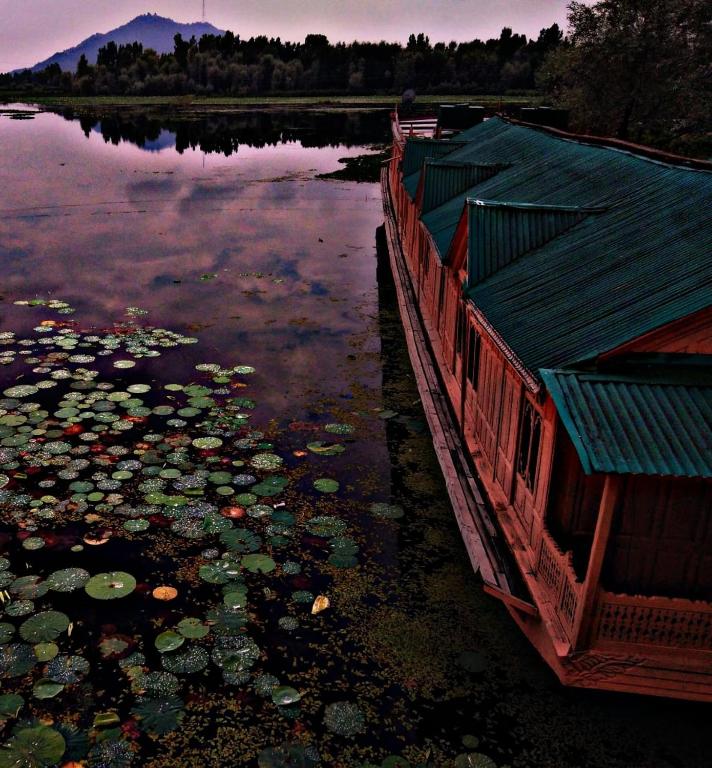 A classic luxury houseboat stay on the peaceful Dal Lake in Srinagar Kashmir